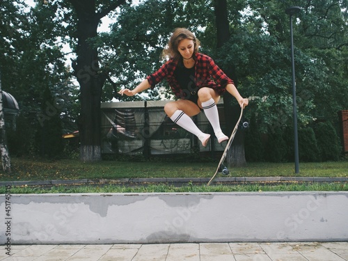 young woman riding a longboard, skateboard