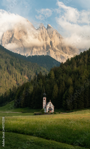Fototapeta Naklejka Na Ścianę i Meble -  Beautiful Church of St. John (Chiesetta di San Giovanni) located in the Dolomites in Italy, south of the Alps in the Val di Funes, isolated chapel in the middle of the mountains, high resolution pano.