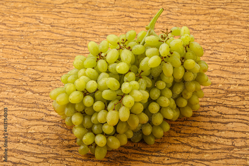 Green grape branch over background Green grape branch over background