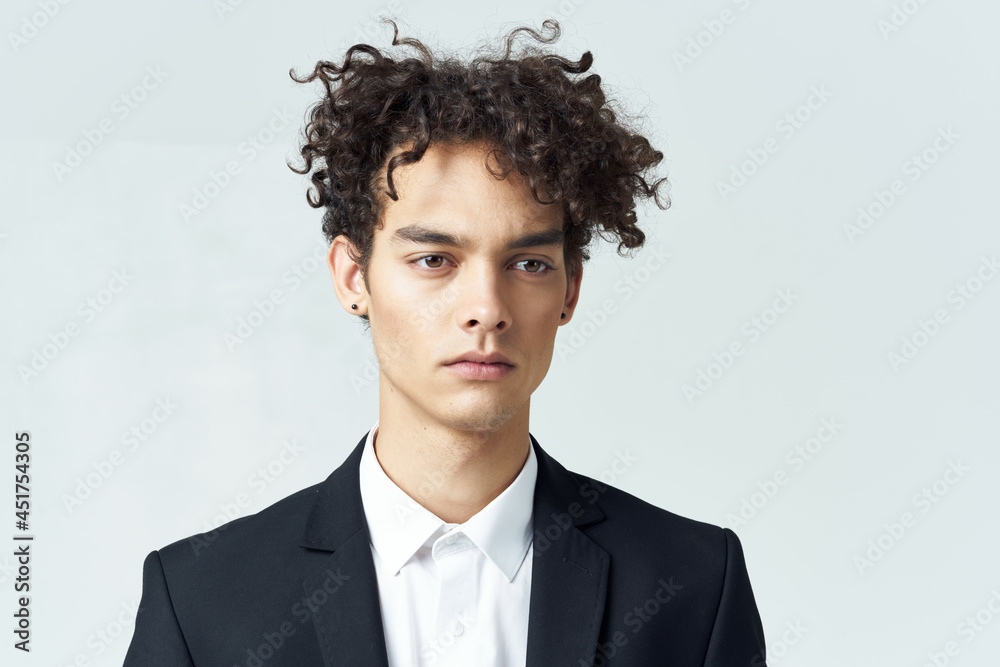 business man with curly hair in suit black blazer studio business man with curly hair in suit black blazer studio