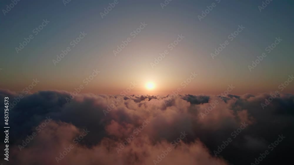 Fly through the clouds during sunrise. Fly through the clouds during sunrise.