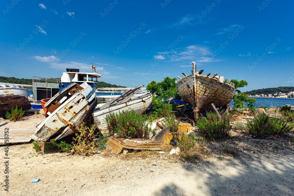 broken boats on the shore, Losinj town, Croatia.