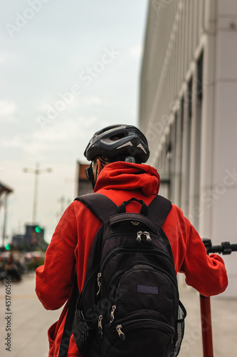 Man with a backpack in the city in the close-up of a tourist