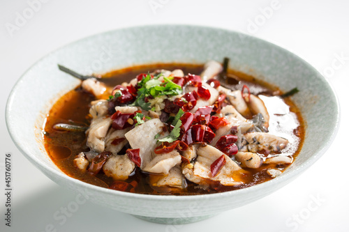 Fish soup with herbs and chili pepper asian food isolated on white background