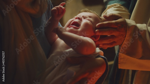 Obraz na plátně Mary and Joseph comforting crying baby Jesus