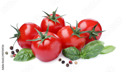 Fresh green basil leaves, spices and tomatoes on white background
