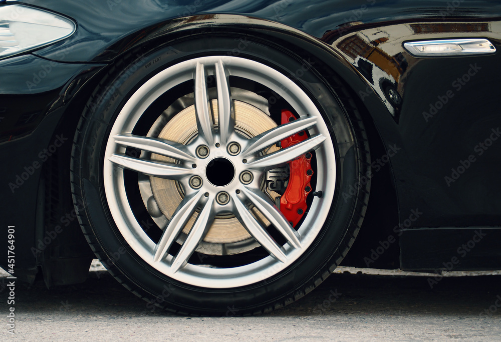 gray rims, tires and brake discs of the sports car
