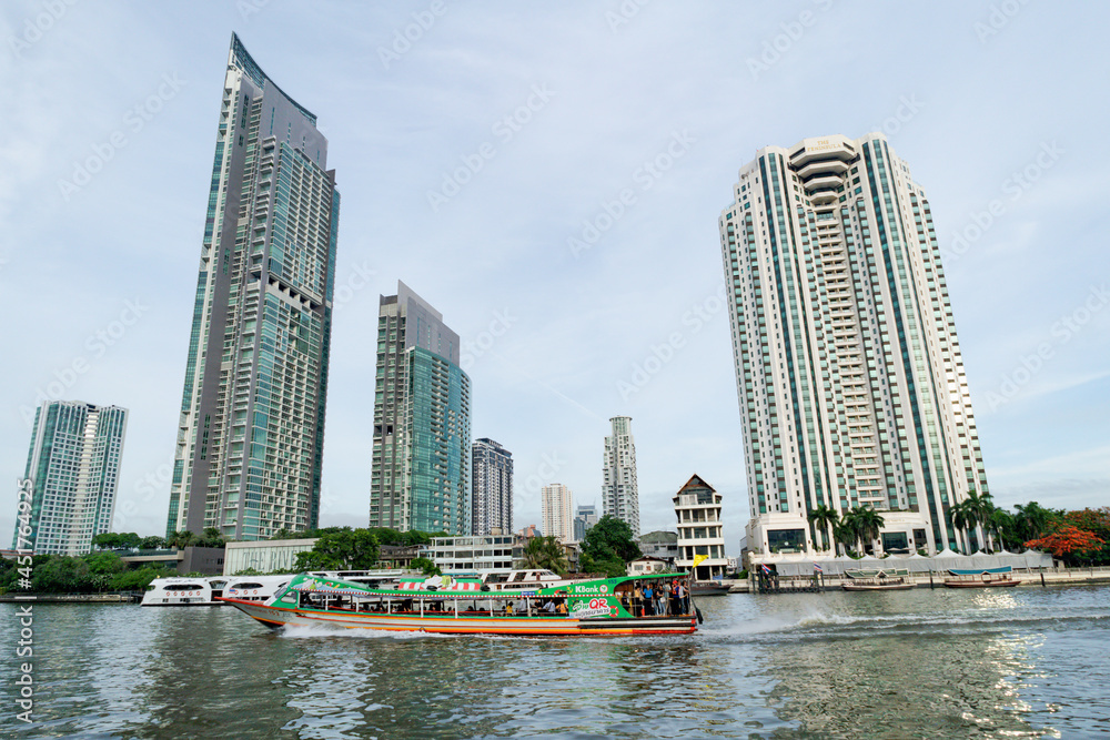 BANGKOK, THAILAND - 24 May 2019 :  high rise buildings located on the river at Chao Phraya river in Bangkok, Thailand