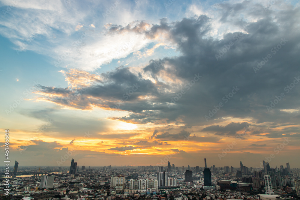 Bangkok, Thailand - Aug 17, 2021: Gorgeous panorama scenic of the sunrise or sunset with cloud on the orange and blue sky over large metropolitan city in Bangkok. Copy space, Selective focus. Bangkok, Thailand - Aug 17, 2021: Gorgeous panorama scenic of the sunrise or sunset with cloud on the orange and blue sky over large metropolitan city in Bangkok. Copy space, Selective focus.
