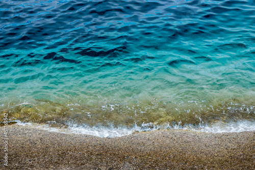 Canvastavla Mare Tirreno sfumature di azzurri acqua limpida che batte sugli scogli