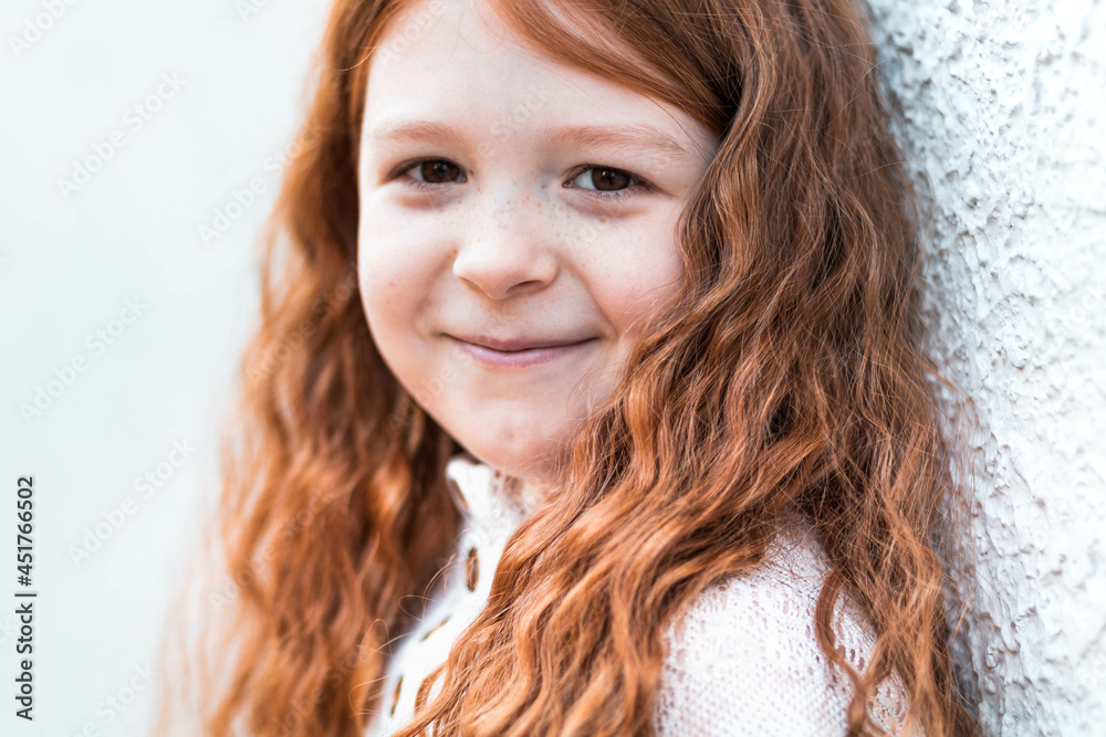Close-up portrait of a cute, little, ginger girl Close-up portrait of a cute, little, ginger girl