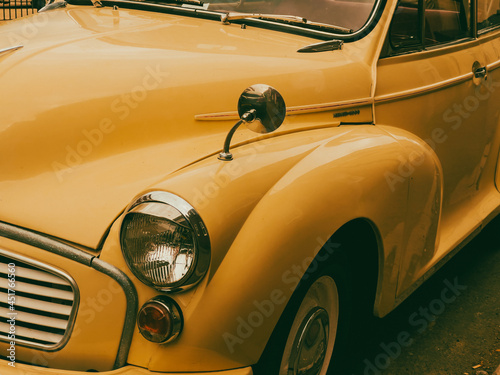 Vintage shot of a yellow automobile © mangomarey