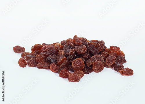An image isolated close-up pile currant dry or grape dry is a sweet fruit food.
