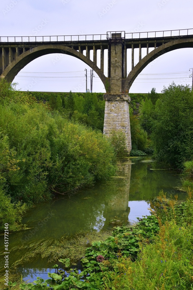 Fototapeta premium Old railway viaduct across the river