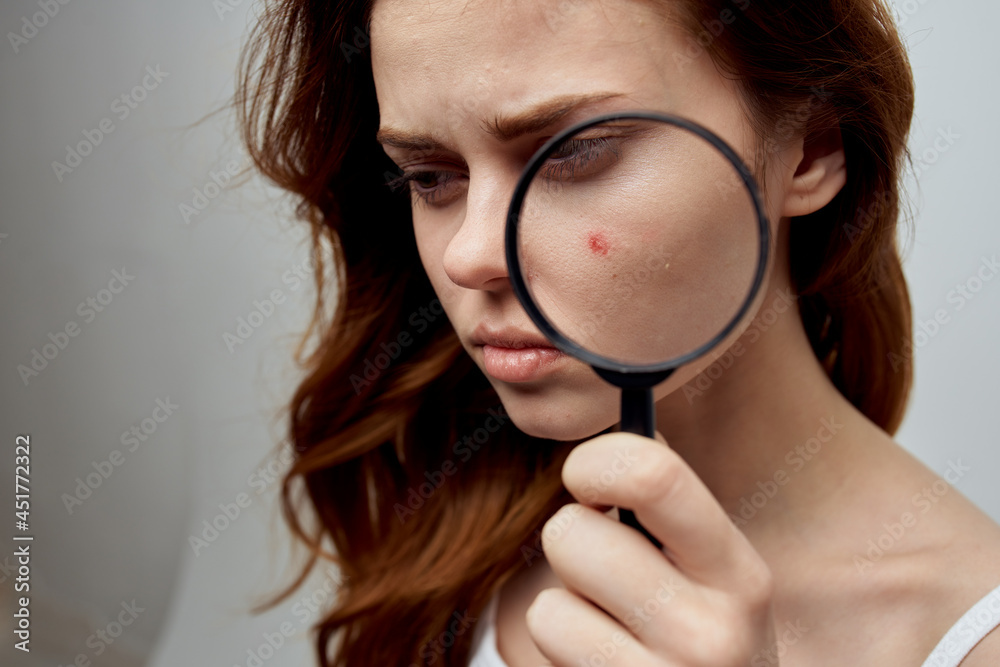 pretty woman with a pimple on the face cosmetology Studio pretty woman with a pimple on the face cosmetology Studio