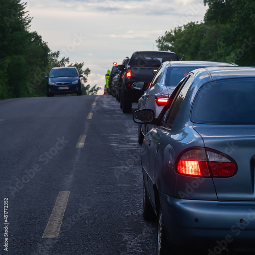 traffic jams on the road are associated with the repair of the roadway. evening