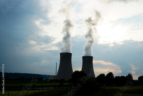 Nuclear power plant in Grohnde with cooling towers and surrounding landscape.