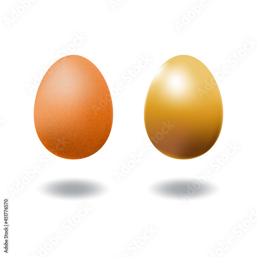 A couple of brown chicken egg and gold egg.