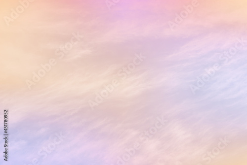 Multi colors and light in soft pastel tone of natural evening cloud and sky background before sunset. A tranquility nature atmosphere image for background and wallpaper.