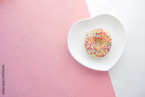 chocolate donuts on plate with copy space