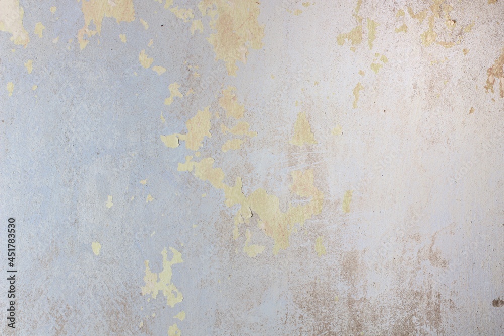 Photo of an unpainted wall with pieces of old paint, texture and patterns Photo of an unpainted wall with pieces of old paint, texture and patterns