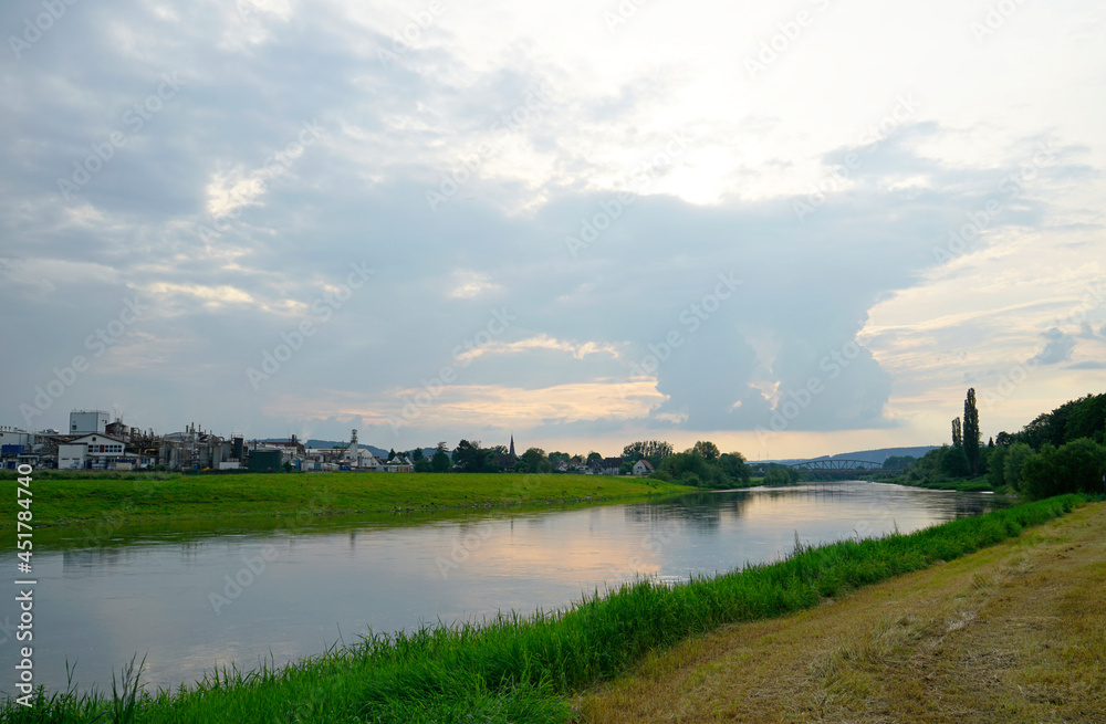View of the Weser and the surrounding landscape. Nature near a river in Germany. View of the Weser and the surrounding landscape. Nature near a river in Germany.