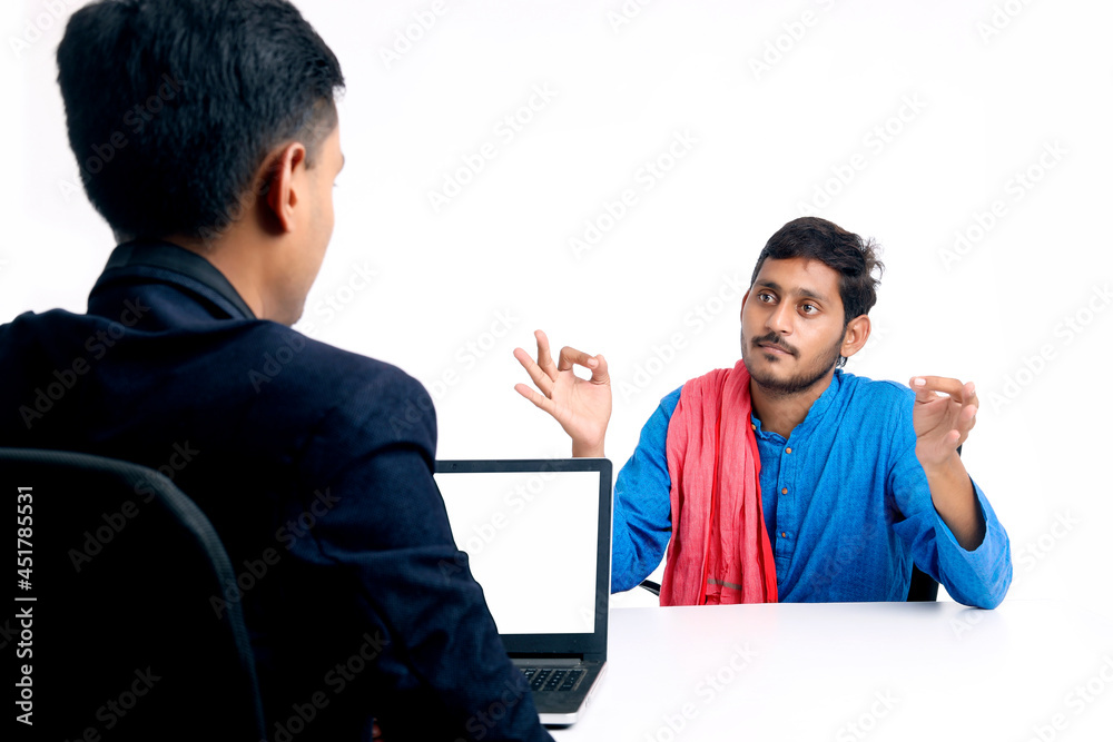 young indian farmer talking to banker or officer at office. young indian farmer talking to banker or officer at office.
