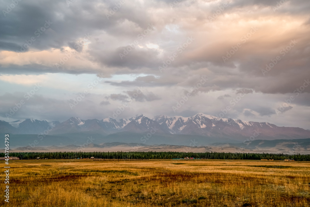 North Chuya Ridge in the early morning with the first rays of the sun. Kurai steppe. Altai Mountains, Russia.