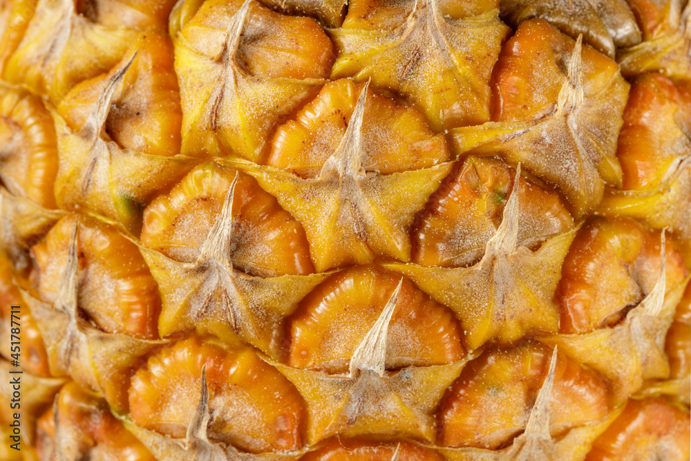 Peel surface of ripe pineapple closeup as background. Peel surface of ripe pineapple closeup as background.