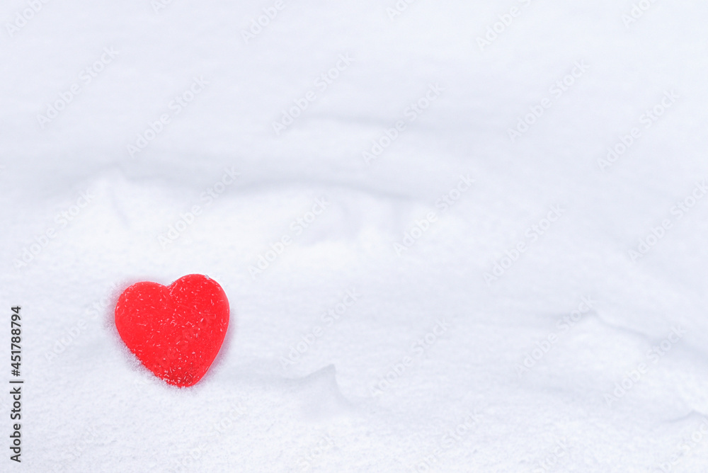 Toy heart in the snow