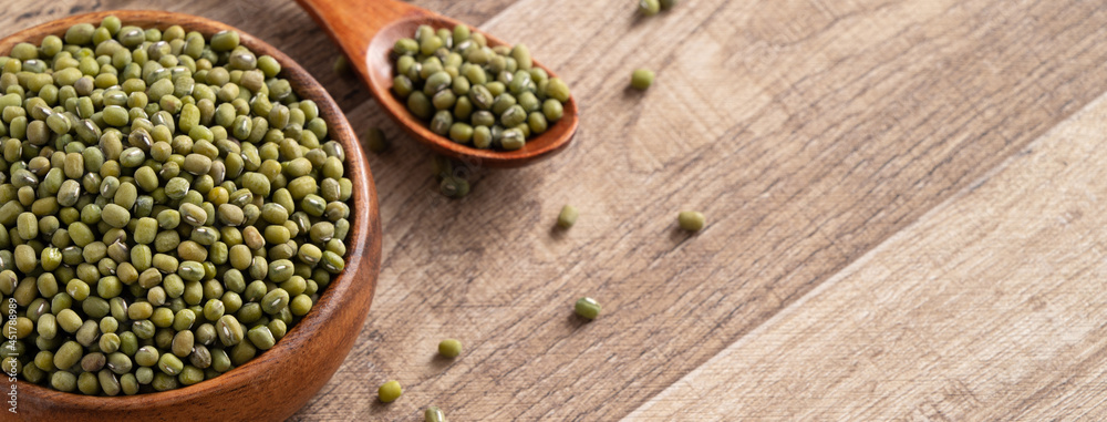 Close up of raw mung bean on wooden table background. Close up of raw mung bean on wooden table background.