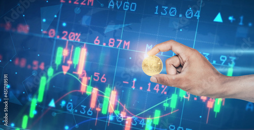 Bitcoin gold coins in business hands and blurry chart background  Concept of virtual currency