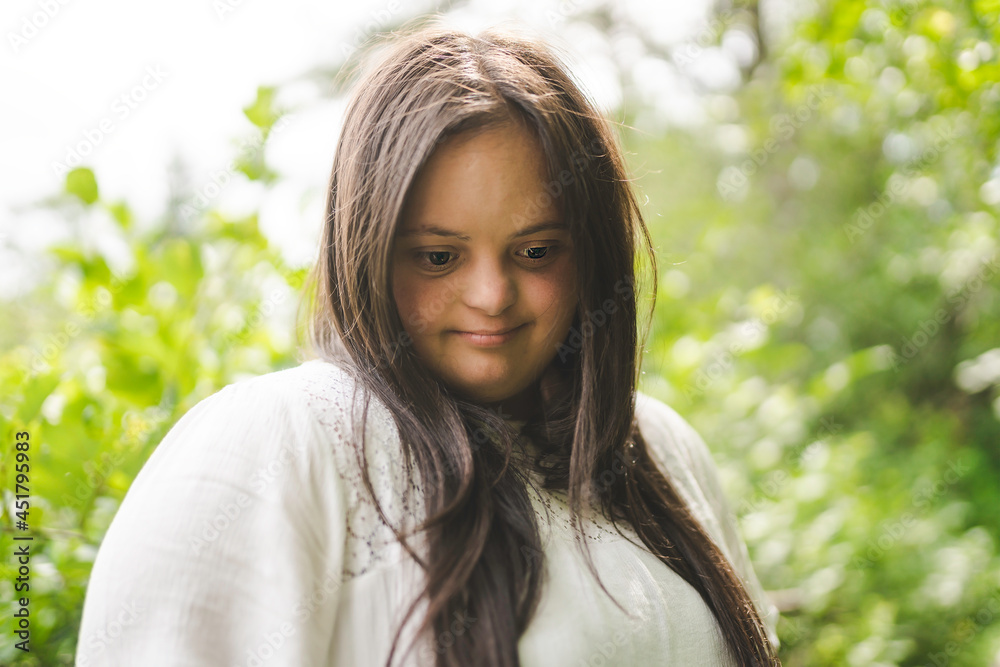 Portrait of trisomy adult outside having fun Portrait of trisomy adult outside having fun