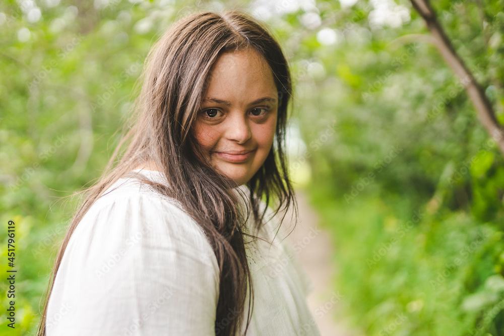 Portrait of trisomy adult outside having fun Portrait of trisomy adult outside having fun