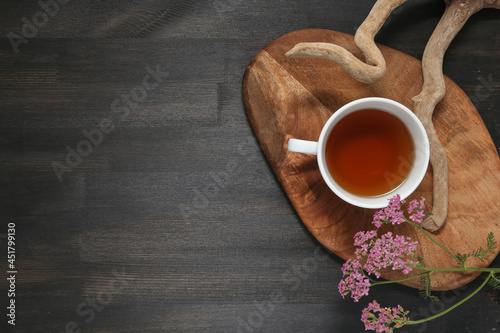 flower on a wooden background with tea
