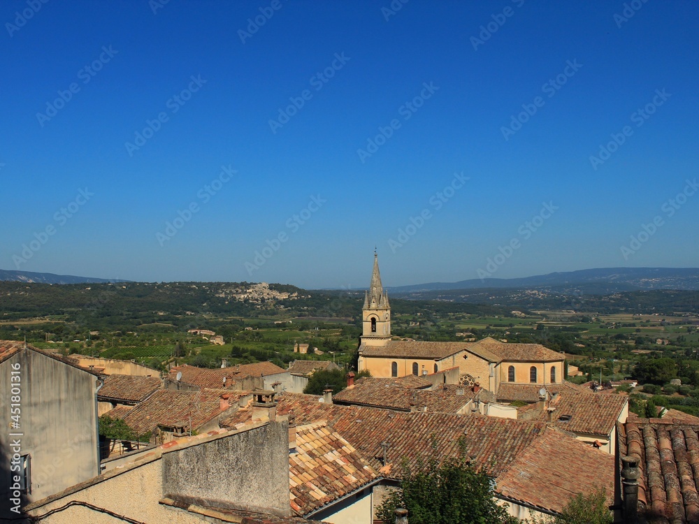 A popular tourist holiday destination, beautiful French village in Provence called Bonnieux. View on antique houses, old roofs, ancient buildings and scenic hills and dales around the town.