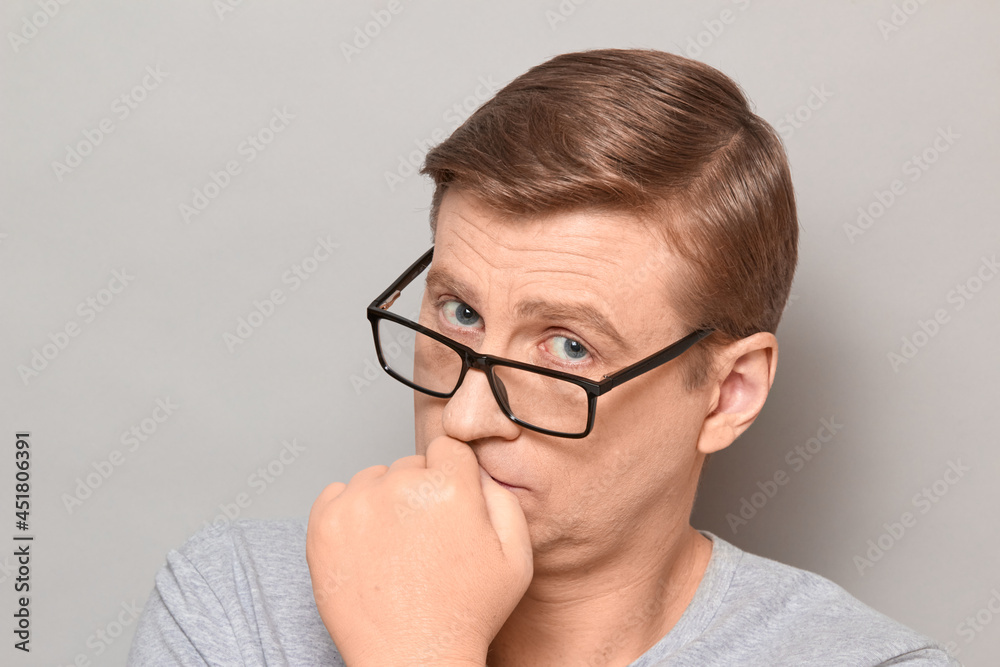 Portrait of serious thoughtful blond mature man with glasses Portrait of serious thoughtful blond mature man with glasses
