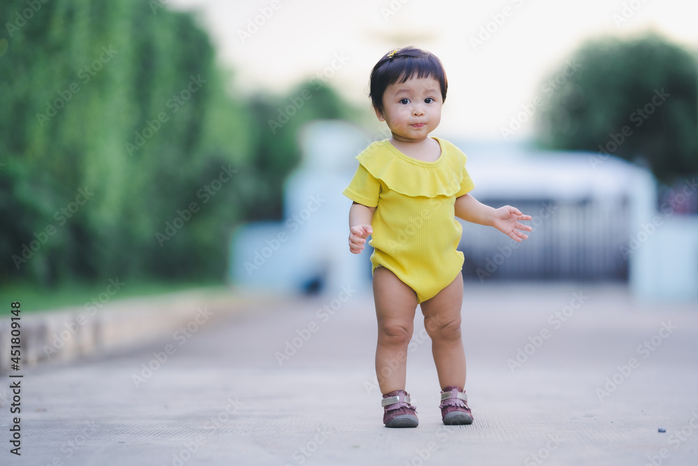 portrait of child standing play and learning nature outside home with fun emotion with blur village background portrait of child standing play and learning nature outside home with fun emotion with blur village background