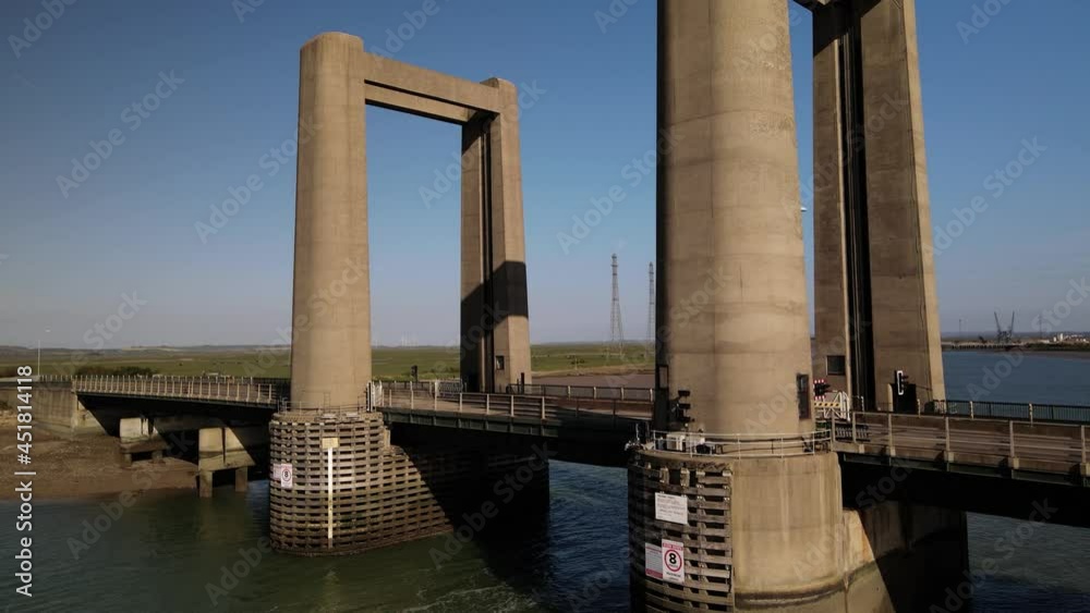 Vertical-Lift Design Of The Kingsferry Bridge Over The Swale In Southeast England. ascending drone shot Vertical-Lift Design Of The Kingsferry Bridge Over The Swale In Southeast England. ascending drone shot