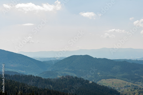 Fascinating panorama of sunset and landscape in the mountains on the hill  Ukrainian Carpathians mountains. Colored and their mountain landscapes. Nature concept