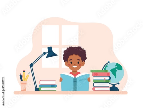 Boy reading a book sitting at a desk. Vector illustration concept in cartoon style