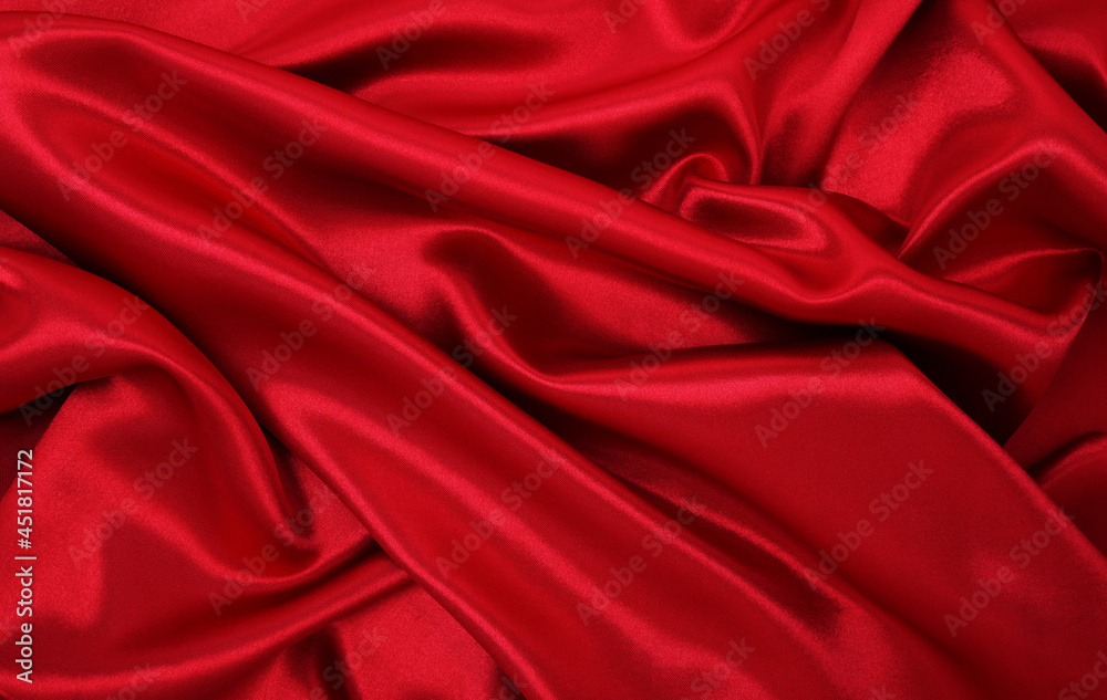 Obraz premium Smooth elegant red silk or satin luxury cloth texture as abstract background. Luxurious valentines day background design