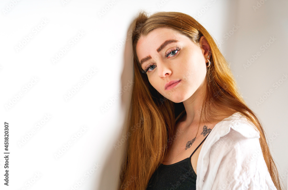 Portrait of young beautiful and cheerful girl looking at camera over white background. Portrait of young beautiful and cheerful girl looking at camera over white background.