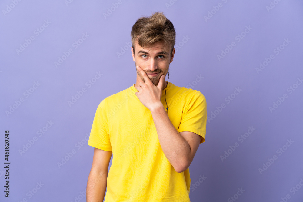 Young handsome blonde man isolated on purple background thinking Young handsome blonde man isolated on purple background thinking