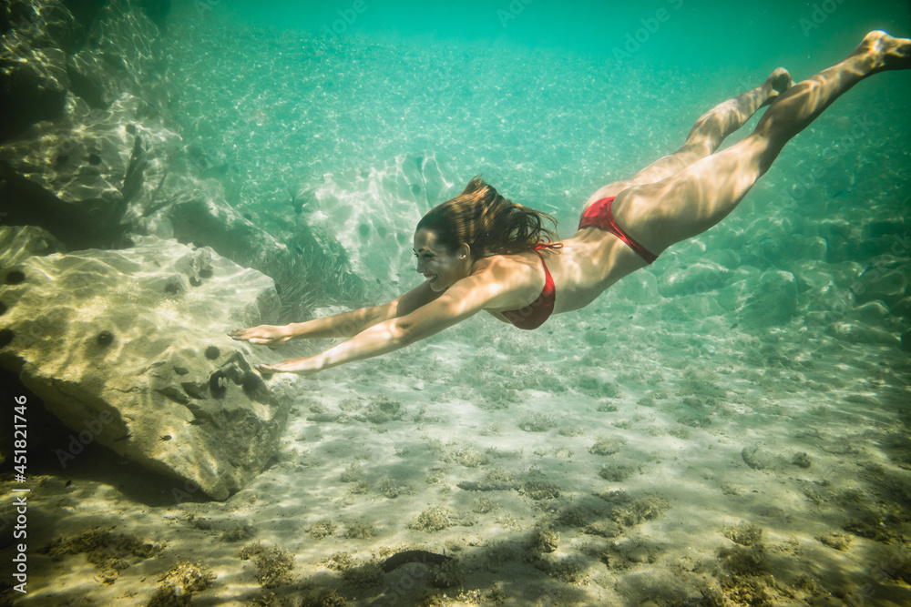Woman Enjoying In Underwater World