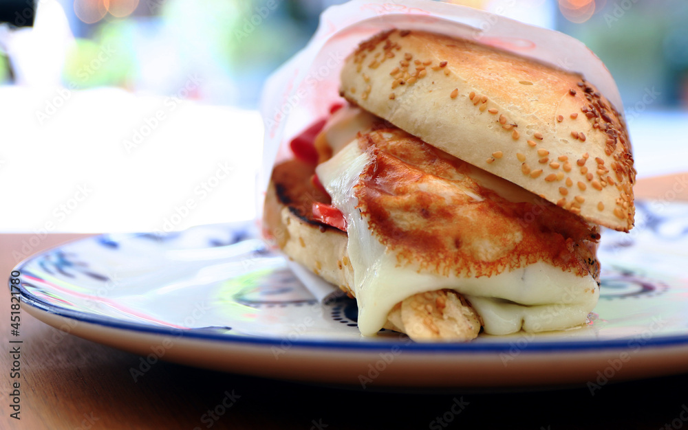 Traditional delicious sandwich, called as Kumru in Turkish, snack with rich ingredients. Special sesame bread sandwich. Traditional delicious sandwich, called as Kumru in Turkish, snack with rich ingredients. Special sesame bread sandwich.