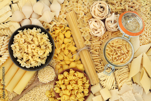Obraz na plátně Large collection of dried Italian pasta food varieties forming an abstract background