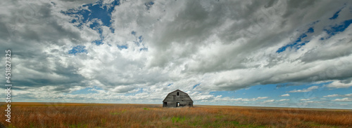 Photography Windswept abandoned barn in the Oklahoma panhandle west of Guymon