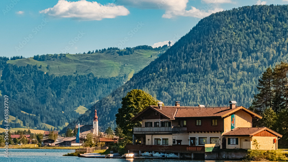 Naklejka premium Beautiful alpine summer view with reflections and the famous Jacob cross in the background at the famous Piller lake, Tyrol, Austria