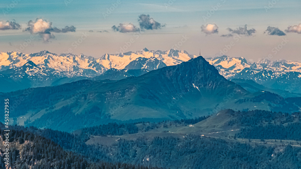 Beautiful alpine summer view with the Kitzbueheler Horn summit and the Hohe Tauern mountains in the background at the famous Steinplatte summit, Waidring, Tyrol, Austria